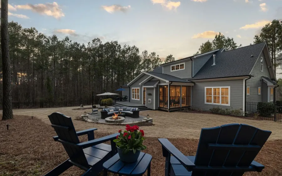 Outdoor living inspiration for Bearden: a backyard at golden hour with a paver fire pit terrace